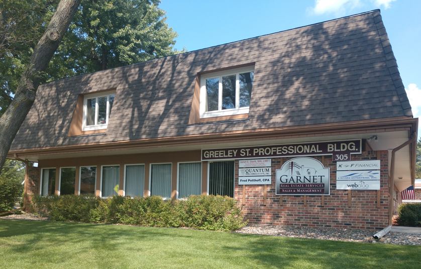 The Greeley St. Professional Building, a brick and shingle office building at 305 Greeley Street South